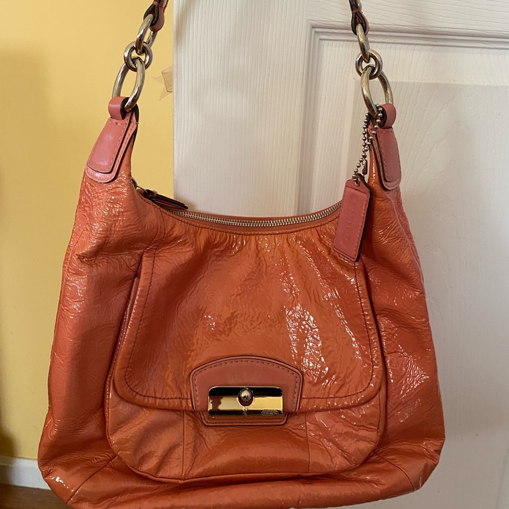 Pink authentic Coach purse. Patent leather type materials